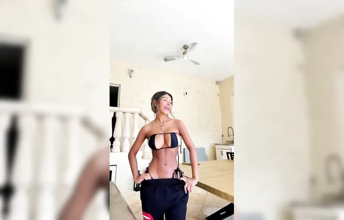 How is she not falling out of this?
