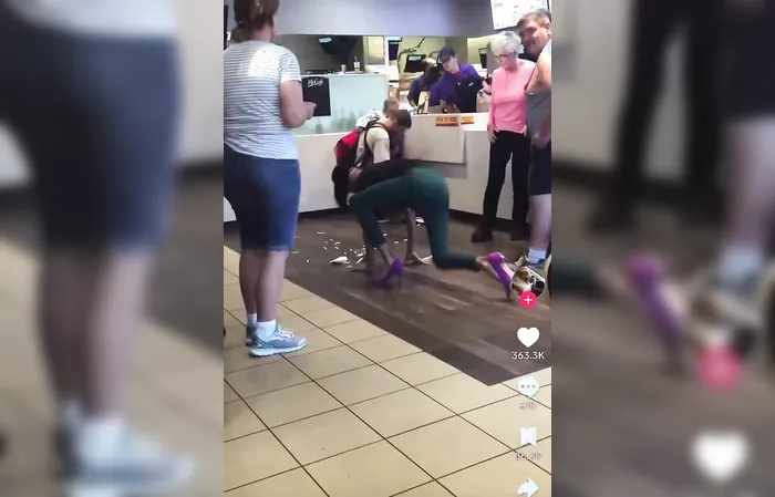 OOPS! Guy in heels and wig drops food all over