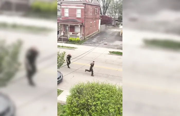 Guy escapes fight with cop, rides away on bicycle