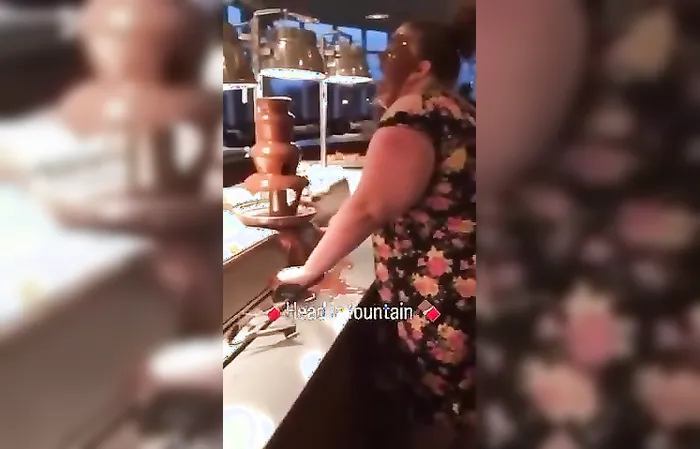 Really lady, sticking your face IN THE FOOD?