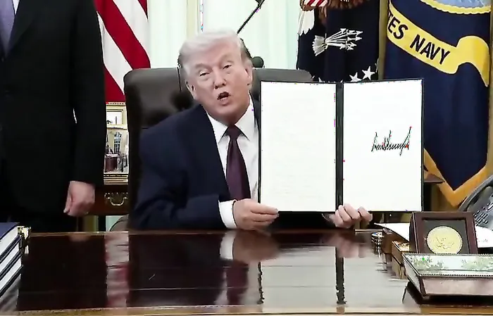 Trump uses a REAL PEN to sign a landmark Executive Order