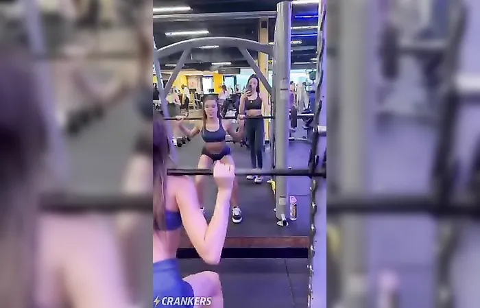 Two sweaty girls working out in the gym