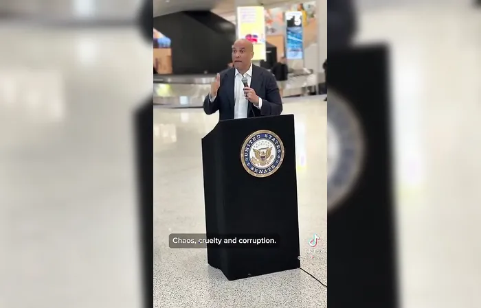 Cory Booker speaks to an empty Newark Airport lmfao