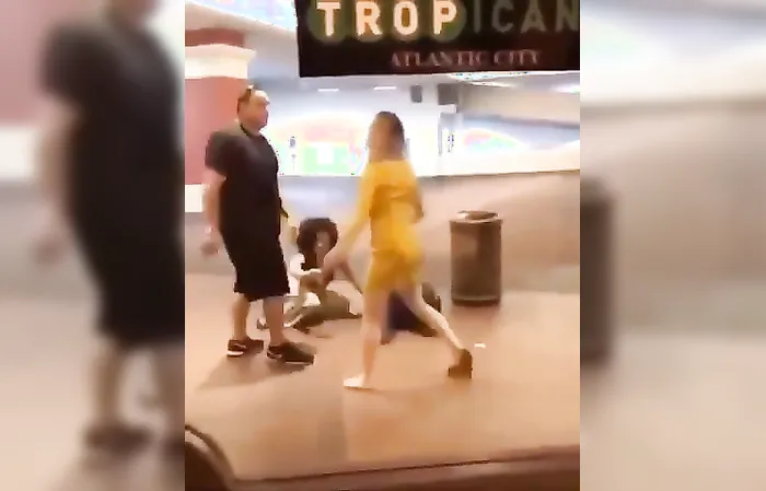 Guy slaps this woman who tried jumping his wife at Tropicana in AC