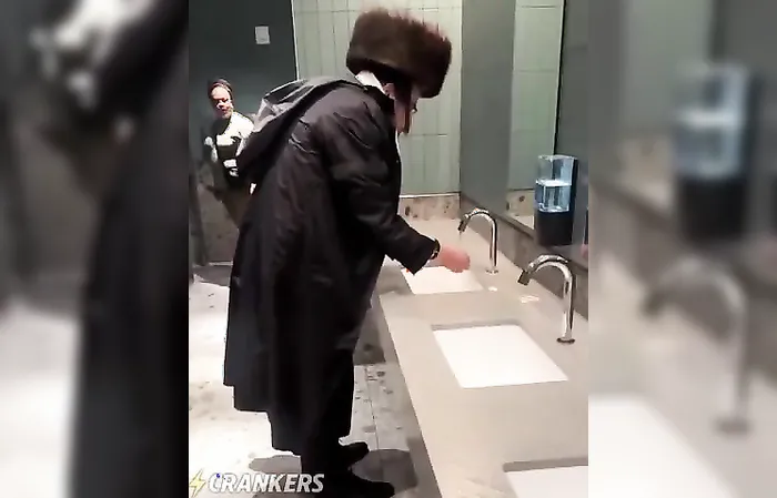 WHAT is that guy doing in the women's bathroom?