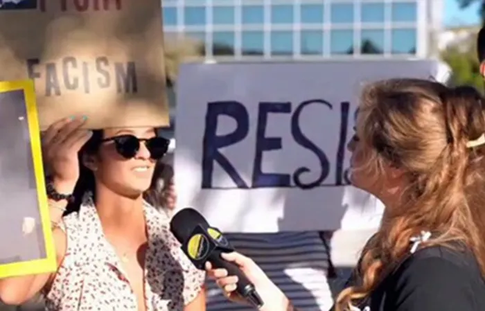 Woman calling people fascist, but can't explain what it means