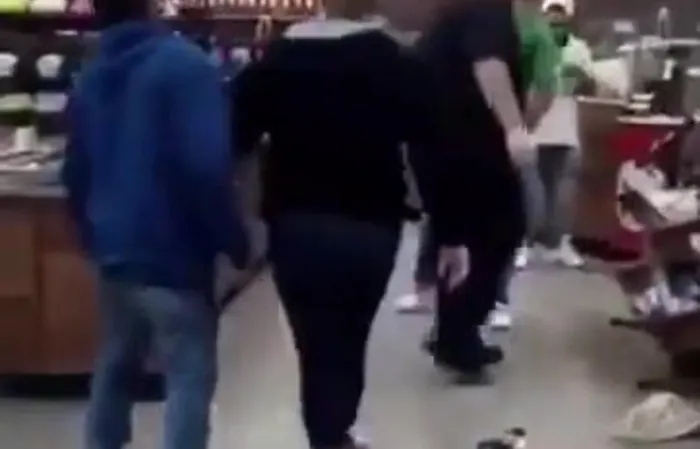 Woman fights a guy in Wawa