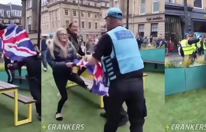 Police officer RIPS a Union Jack flag because it was offending migrants