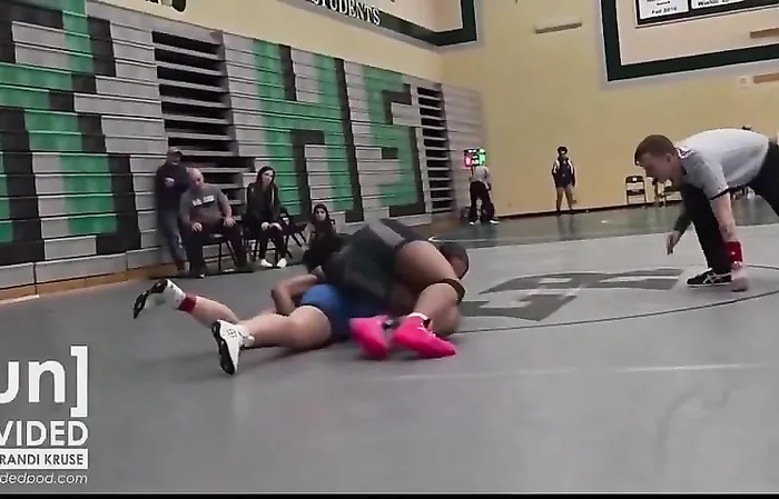 Female wrestler touched inappropriately by male wrestler