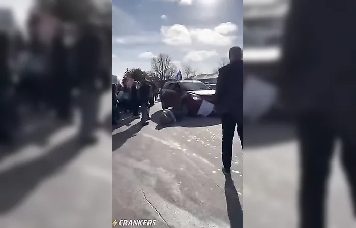 Protester runs into moving car with Trump flag, gets whacked