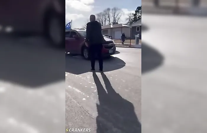 Protester runs into moving car with Trump flag, gets whacked