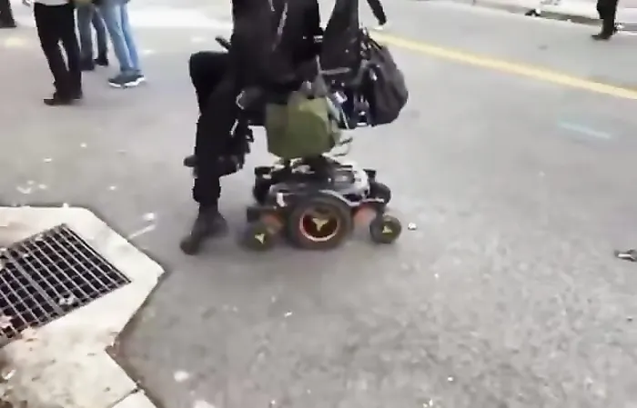 Wheelchair bound ICE protester seems to have a divine intervention