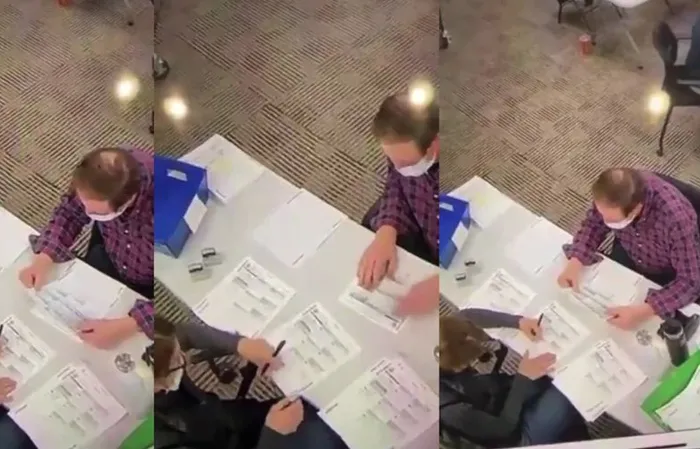 Footage of poll workers allegedly filling out ballots during 2020 election