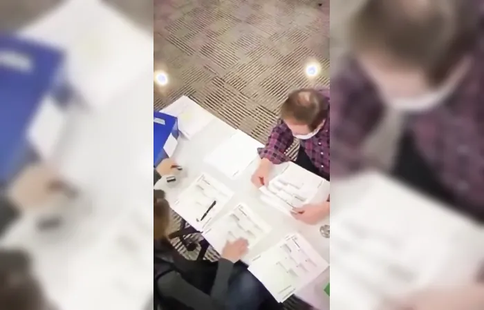Footage of poll workers allegedly filling out ballots during 2020 election