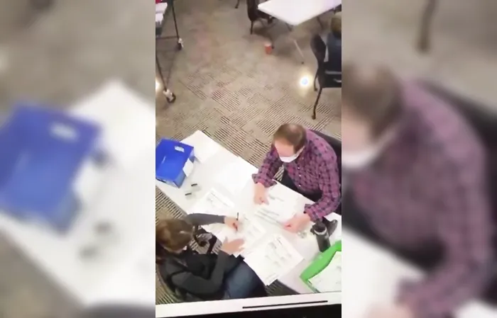 Footage of poll workers allegedly filling out ballots during 2020 election