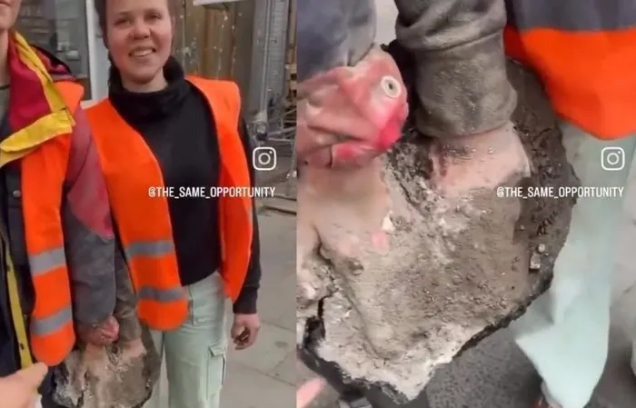 Two protesters have hands stuck in concrete