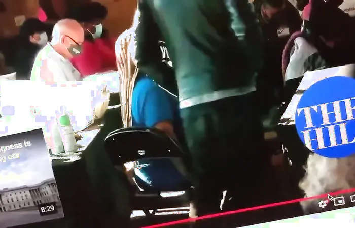 2020 video shows Georgia poll workers passing USB drive suspiciously