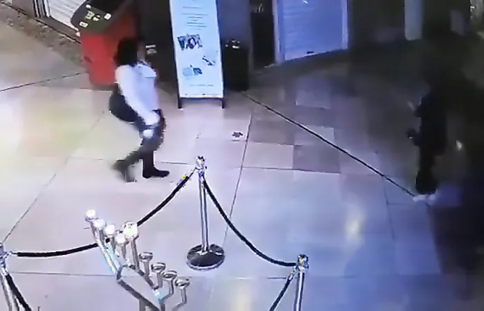 Muslim woman blows out menorah candles during Hannukah