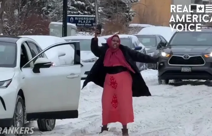 Woman blocking traffic so she can scream into the clouds