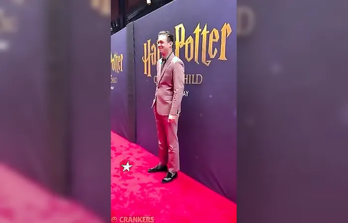 Male Harry Potter star wears a DRESS while being kissed by actor Tom Felton