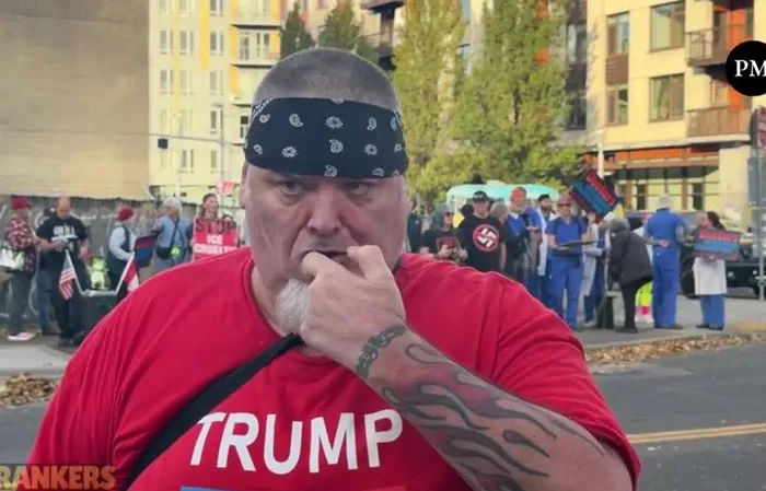 Anti-ICE protester rubs pepper ball residue in his gum to show off