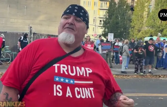 Anti-ICE protester rubs pepper ball residue in his gum to show off