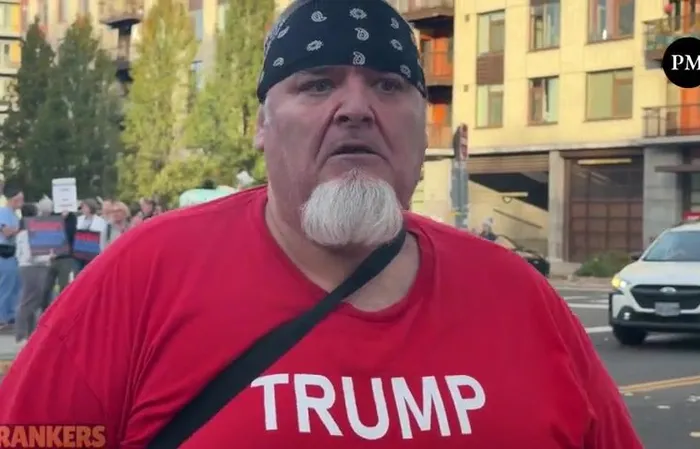 Anti-ICE protester rubs pepper ball residue in his gum to show off