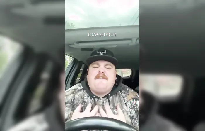 Barely known country singer Bryan Andrews cries in a truck about ICE