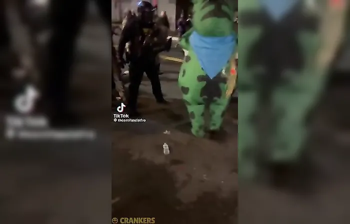 Officers sprays mace in the air vent of a costume wearing Antifa member in Portland