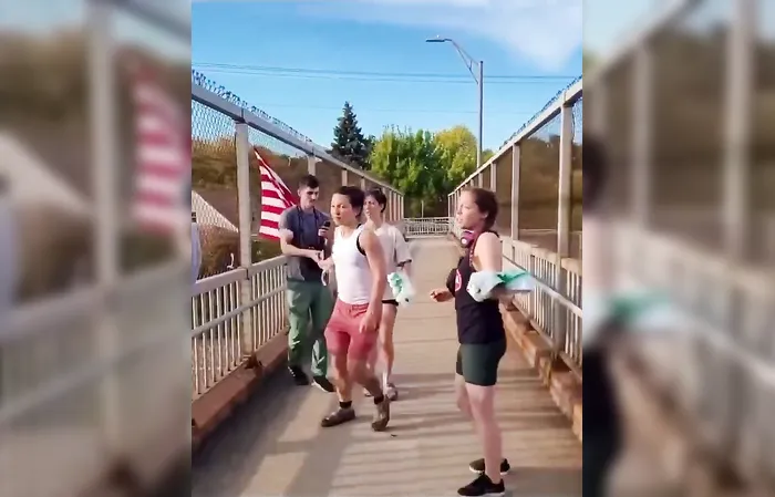 Group of feminists try destroying an American flag