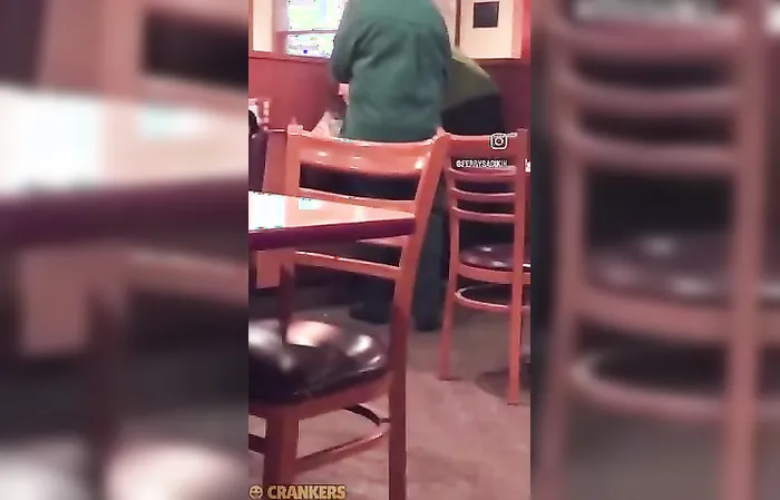 Big dude gets in woman's face at Dennys