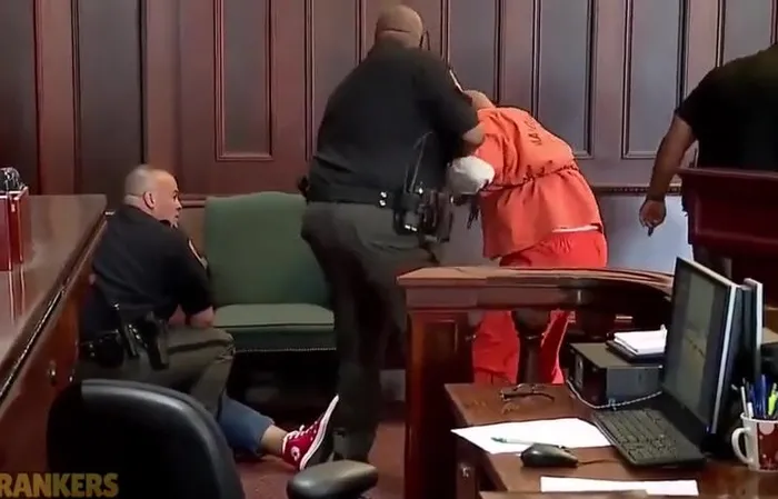 Brothers attacked their mom’s killer in court