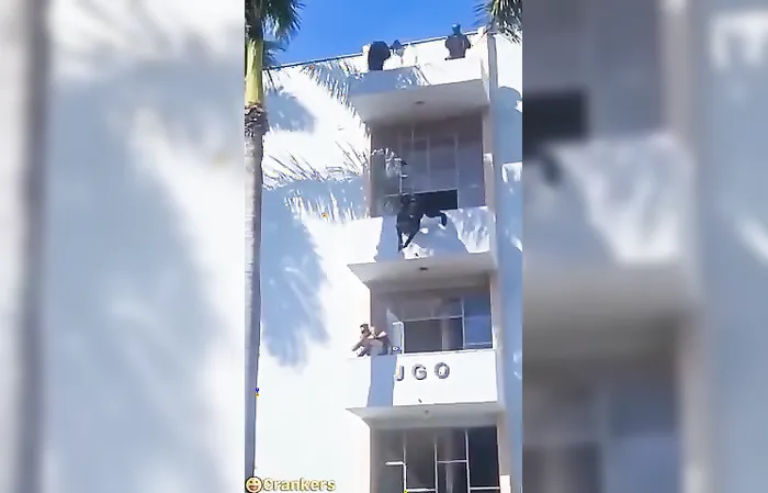 Cop is like spiderman taking out suspect holding someone hostage