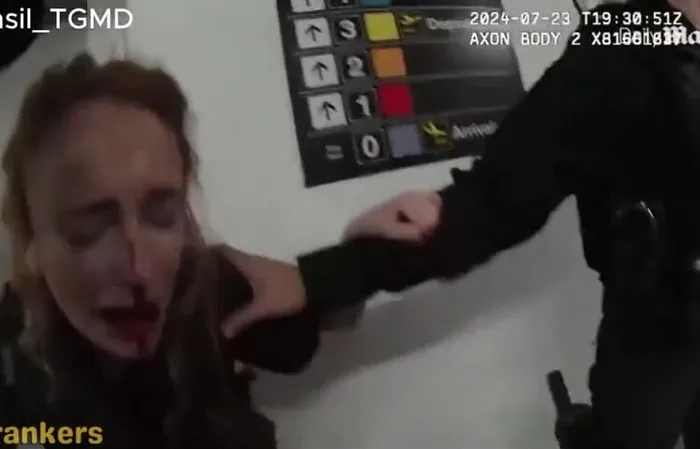 Female cop crying over a broken nose