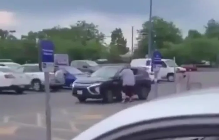 Dude gets hit by car TWICE, goes FLYING across parking lot