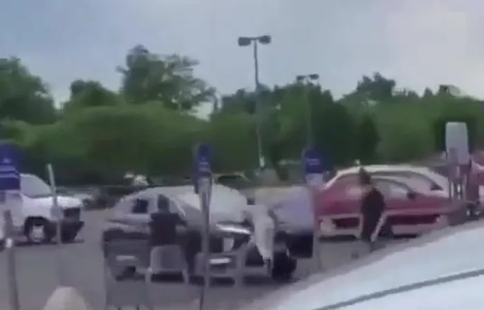 Dude gets hit by car TWICE, goes FLYING across parking lot