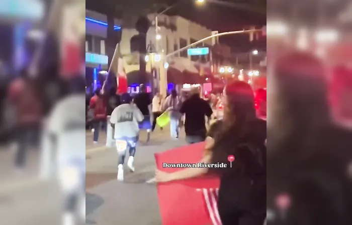Rioters attack car, driver speeds up and hits someone while trying to escape