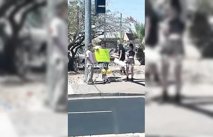 Guy holds up funny sign mocking protesters
