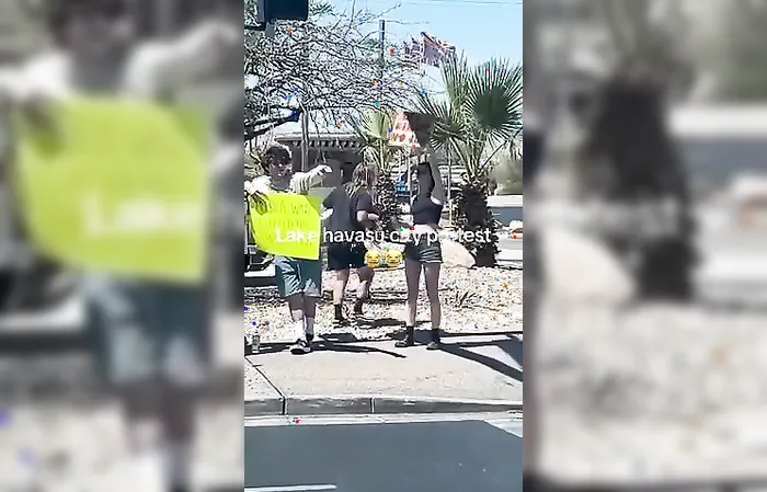 Guy holds up funny sign mocking protesters