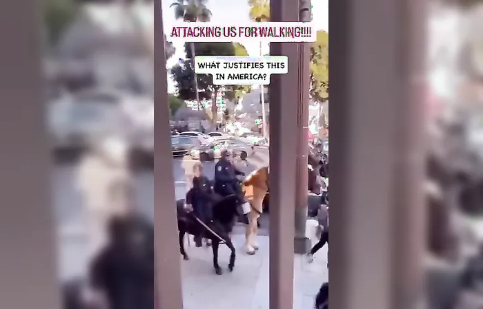 Horse cops beat protesters with sticks
