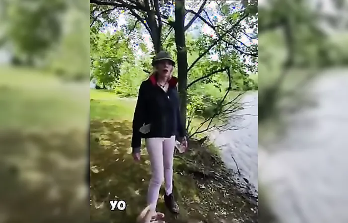Guy dressed like woman harasses someone who's fishing
