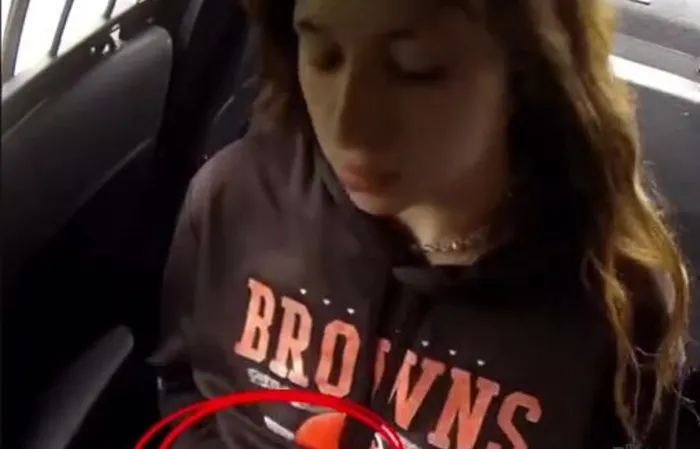 Girl slips out of handcuffs and drinks a White Claw in cop car