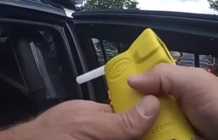 Girl slips out of handcuffs and drinks a White Claw in cop car