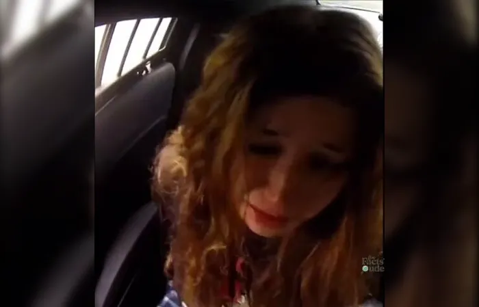 Girl slips out of handcuffs and drinks a White Claw in cop car