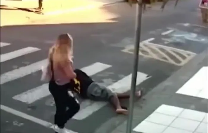 Woman takes out suspect in the streets