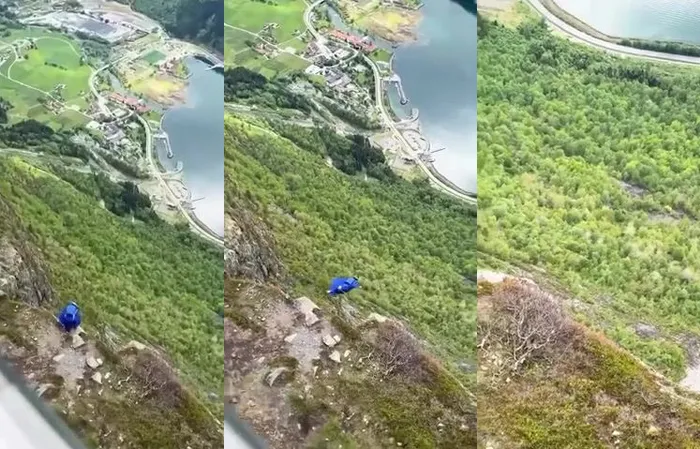 Dude jumps off cliff with rare wing-suit