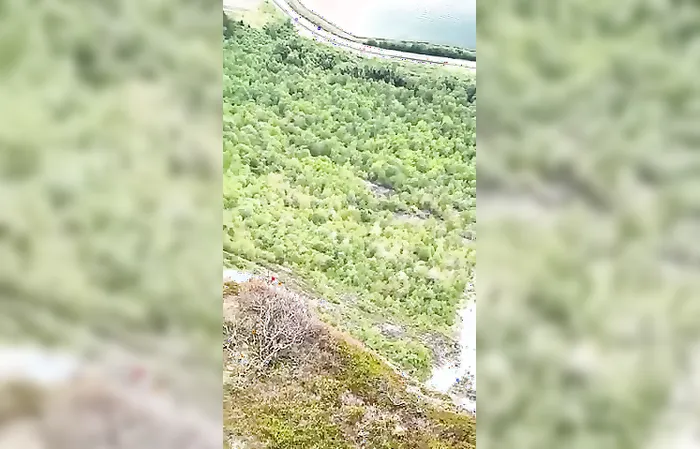 Dude jumps off cliff with rare wing-suit