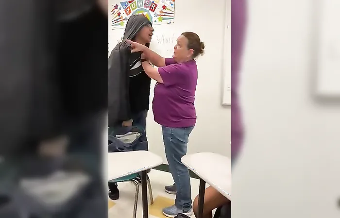 Adult holds back student who gets SUCKER PUNCHED