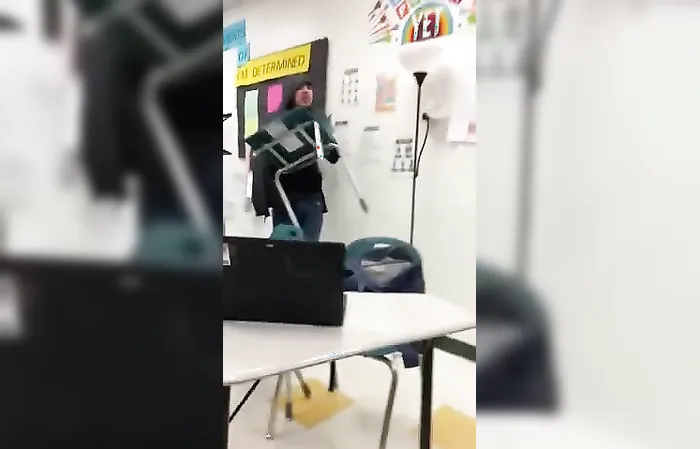 Adult holds back student who gets SUCKER PUNCHED