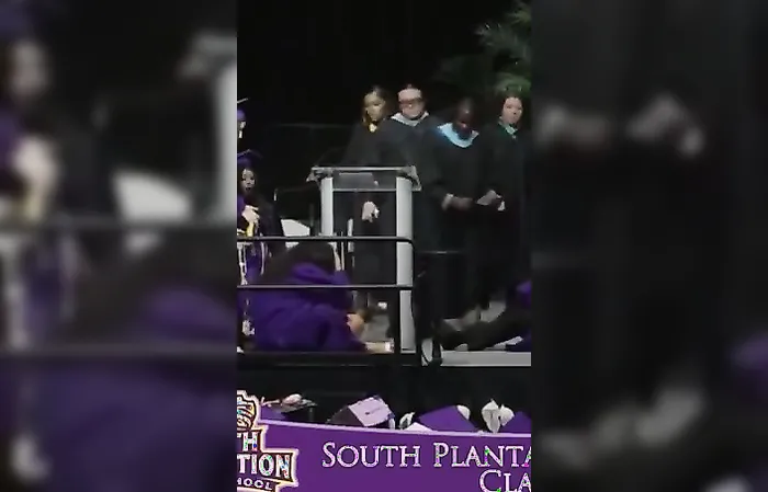 Girl gets KICKED in head during graduation backflip
